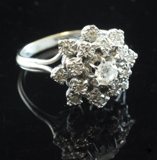 An 18ct white gold and diamond cluster ring, size H.